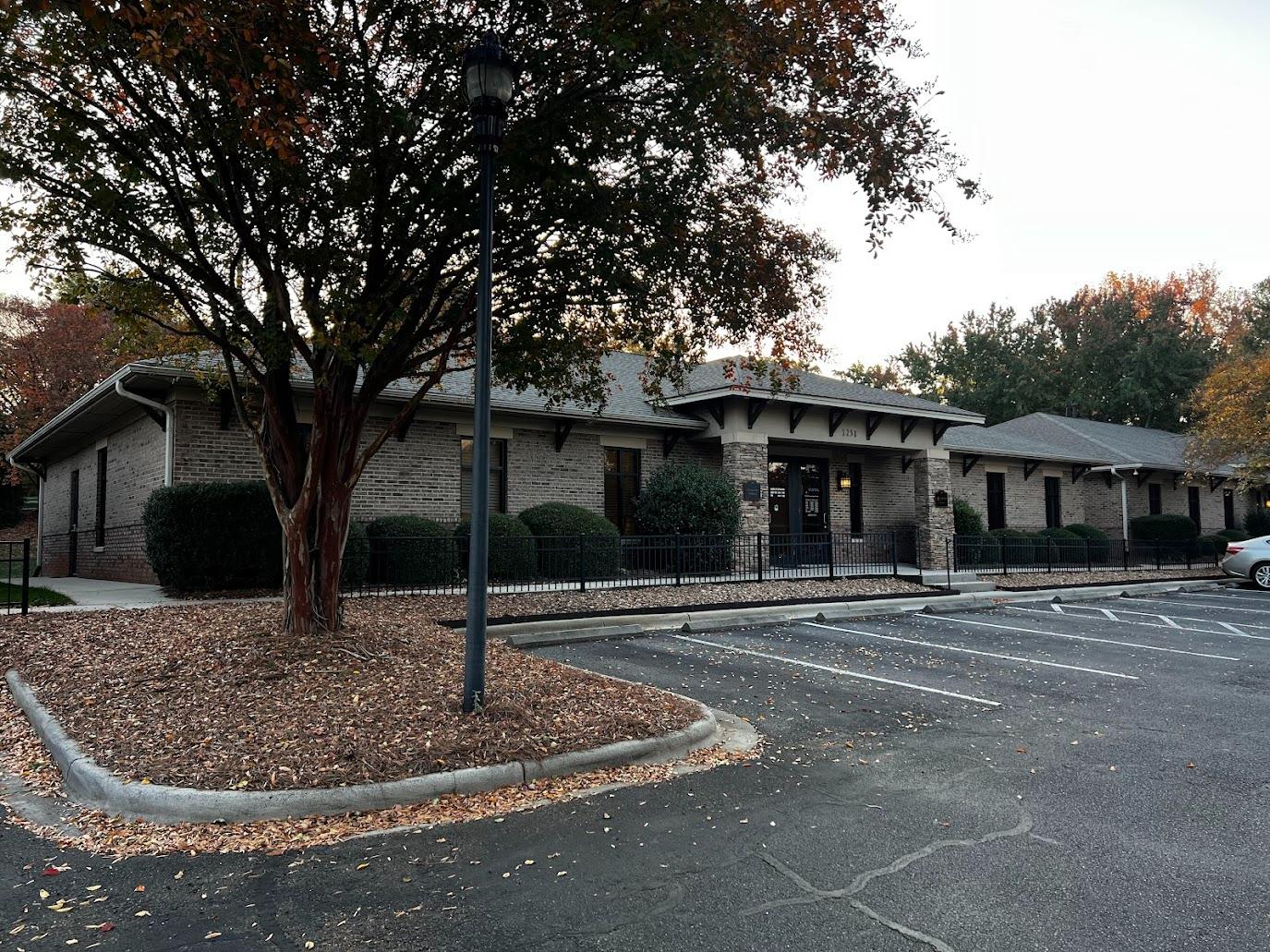 Exterior view and parking at 1258 Mann Drive Unit 100 medical office condo in Matthews, North Carolina